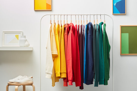 Row of vivid clothing on rack