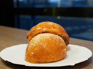 Two pies on a background of a night window. Blurred blue background.