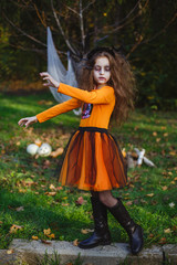 Little girl transformed into scary zombies, dressed for Halloween.