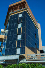 building in city solar panels on the walls