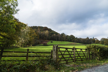 Fototapeta na wymiar A double wooden gateway seen beside Lake Windermere in Cumbria during the autumn of 2019.