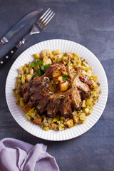 Crown roast of pork with apple and bread stuffing. View from above, top view