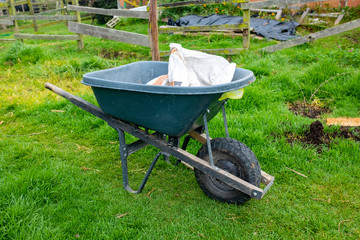 Wheelbarrow Loaded with Construction Materials, on a Farmland