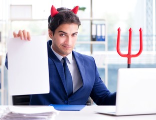 The devil angry businessman in the office