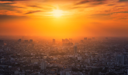 Bangkok District with Glowing Sun at Sunset