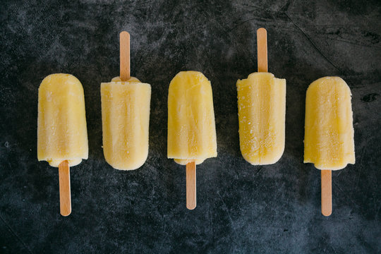 Row of lemon ice pops