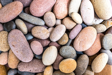 Fototapeta na wymiar Round beach rocks to decorate the home.