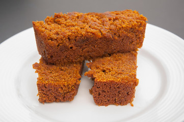 Slices of pumpkin bread on white plate