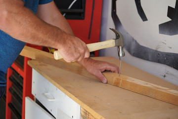 Hammering a Nail into Wood
