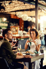 Young couple enjoying in lunch in a restaurant.