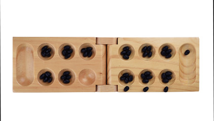 Stones and wooden folding board for playing mancala.