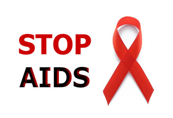 World AIDS day concept. Red ribbon or awareness ribbon as symbol for the solidarity of people living with HIV or AIDS.  