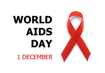 World AIDS day concept. Red ribbon or awareness ribbon as symbol for the solidarity of people living with HIV or AIDS.        