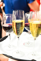 Glasses of cold champagne with unfocused background.