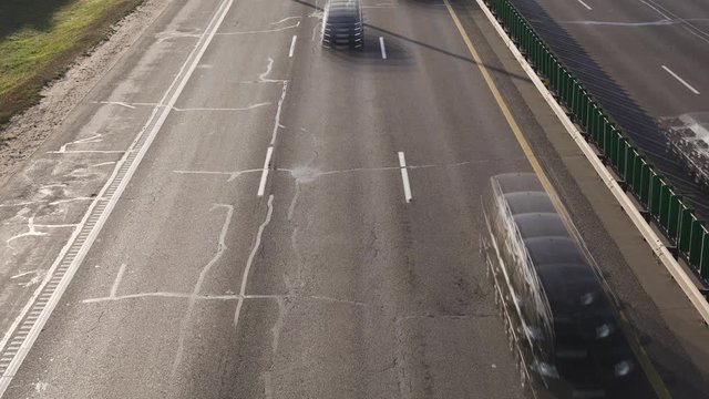 A time lapse footage of traffic on Highway.  Highway traffic. Trucks and cars on the road.