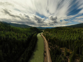 Aerial Panoramic View of a Scenic Highway in the Valley surrounded by Canadian Mountain Landscape. Taken near Clearwater, North of Kamloops, British Columbia, Canada.