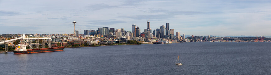 Downtown Seattle, Washington, United States of America. Aerial Panoramic View of the Modern City on the Pacific Ocean Coast during a sunny and cloudy Autumn Day.