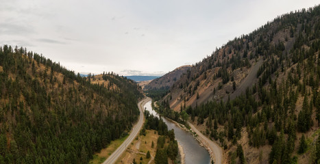 Aerial Panoramic View of a scenic Highway in the Valley surrounded by Canadian Mountain Landscape. Taken near Princeton, British Columbia, Canada.