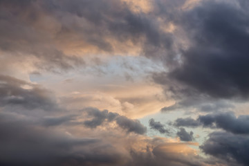 Obraz premium Dramatic View of a cloudscape during a dark, rainy and colorful sunset. Taken in Alaska, USA.
