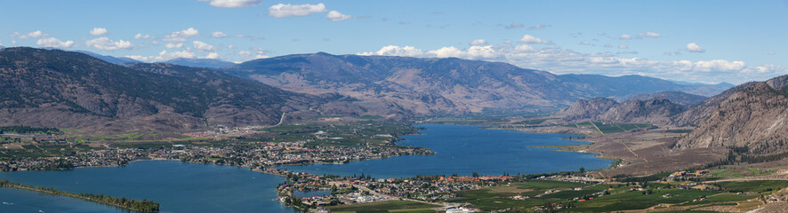 Aerial Panoramic View of a Small Touristic Town during a beautiful sunny summer day. Taken in Osoyoos, British Columbia, Canada.