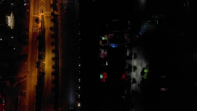 Aerial overhead shot city road with traffic at night