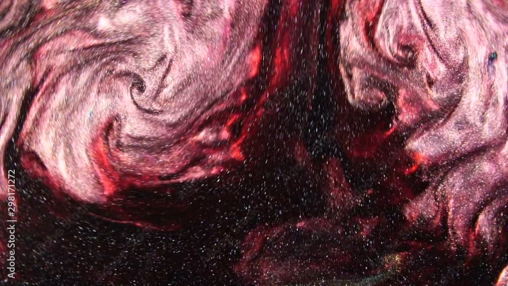 Poster dark red liquid with sparkles and pearly shine. abstract background. slow motion