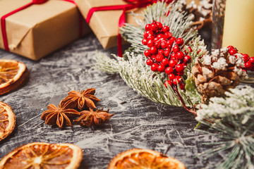 Christmas card concept with holiday decor on grey concrete background.