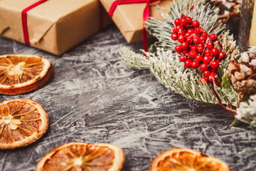 Christmas card concept with holiday decor on grey concrete background with copy space.