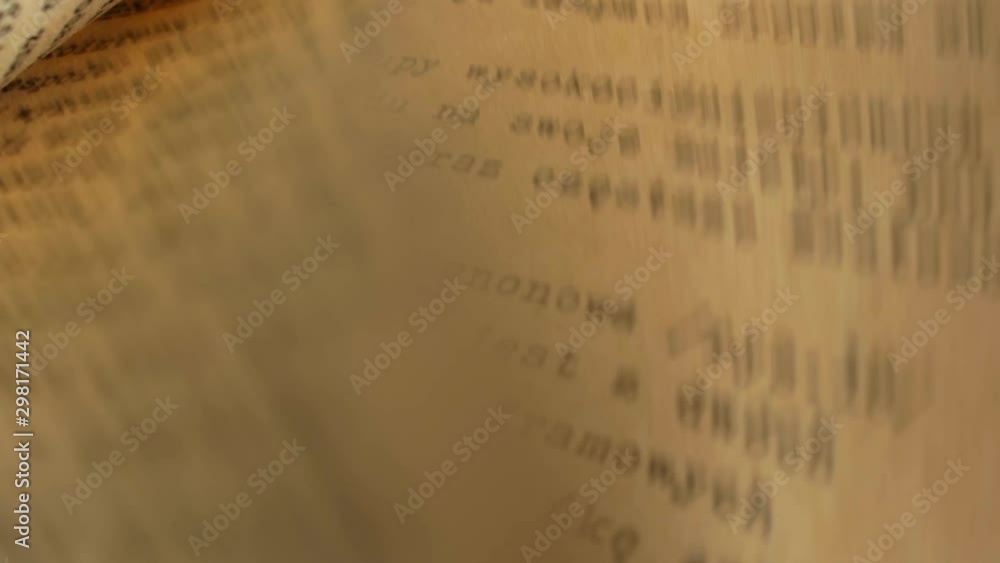Poster flicking through old typescript technical book pages close-up