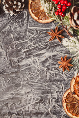 Christmas card concept with holiday decor on grey concrete background with copy space.