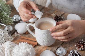 Christmas toys and a Mug of coffee with fluffy white marshmallow.