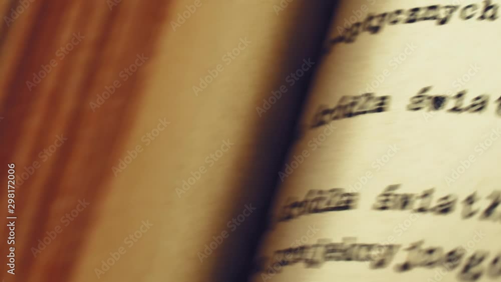 Aufkleber flicking through old typescript technical book pages close-up