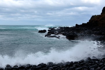 waves crashing on rocks