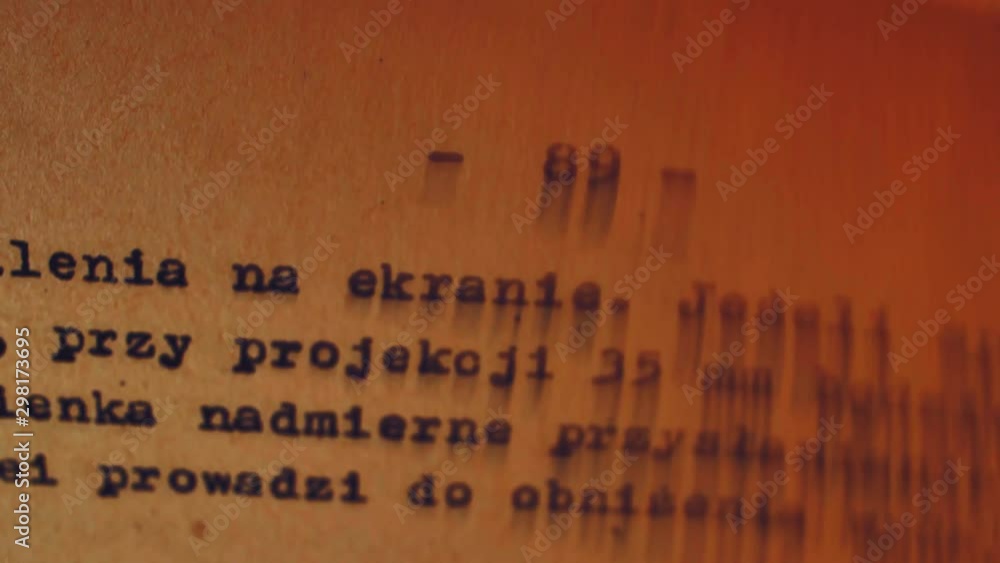 Aufkleber flicking through old typescript book page numbers close-up
