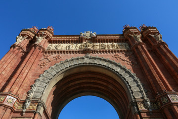 Obraz premium Arc de Triomf, Triumphal Arch in Barcelona, Catalonia, Spain. A triumphal arch is a famous monumental structure one of the most influential architectural landmarks from Ancient Rome.
