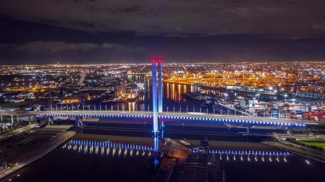 Aerial Hyperlapse of Night Dockland traffic on Highway Bridge in Melbourne, Australia
