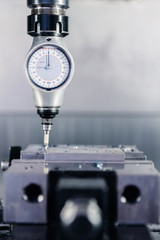 Measuring instrument placed on CNC machine in the factory.