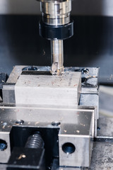 Metalworking CNC milling machine. Cutting aluminium parts in modern processing technology.