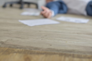 A dedicated company staff works hard even when they get sick and fall ill. Business concept