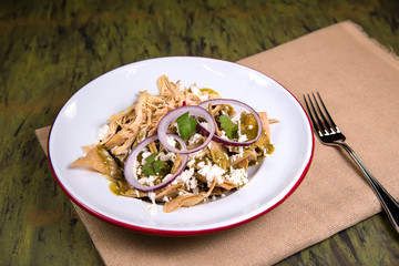 Chilaquiles in a white plate - mexican food
