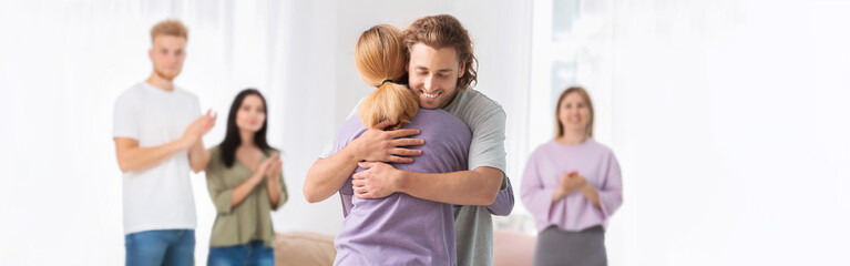 Fototapeta premium People hugging at group therapy session