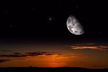 Fototapeta na wymiar Moon against the background of a bright cloud . Half moon . Crescent moon with beautiful sunset background . Generous Ramadan . Light from sky . Religion background . NASA 