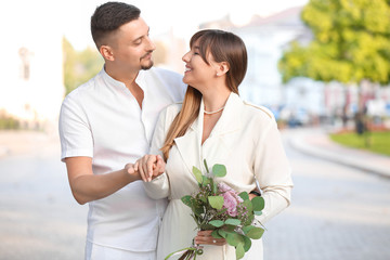 Happy young couple on romantic date outdoors