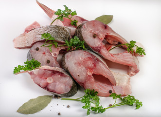 Fish steak with spices on white background
