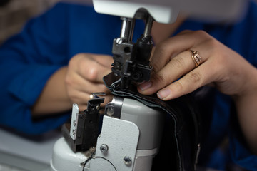 The process of sewing shoes on a sewing machine. Shoe production.