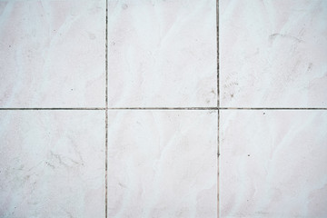 White ceramic floor tiles for the decoration of the bedroom.