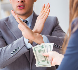 Businessmanbeing offered bribe for breaking law