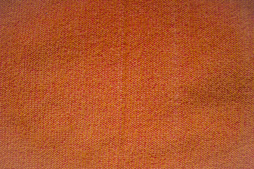 The fabric texture is orange. Background for design.