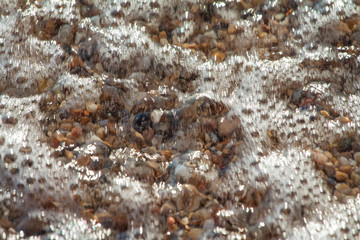 sea pebbles colored granite on the beach