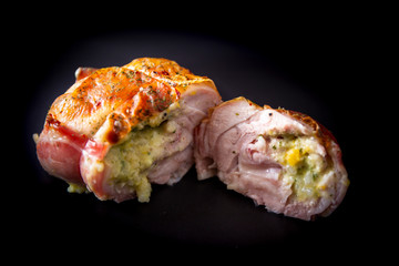 Chicken wrapped in bacon on the plate